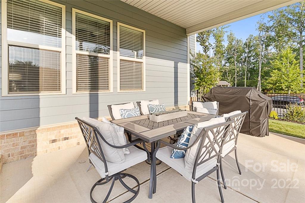 7001 Fallondale Road Waxhaw, NC 28173 - Photo 27 of 32 a patio with table and chairs and potted plants