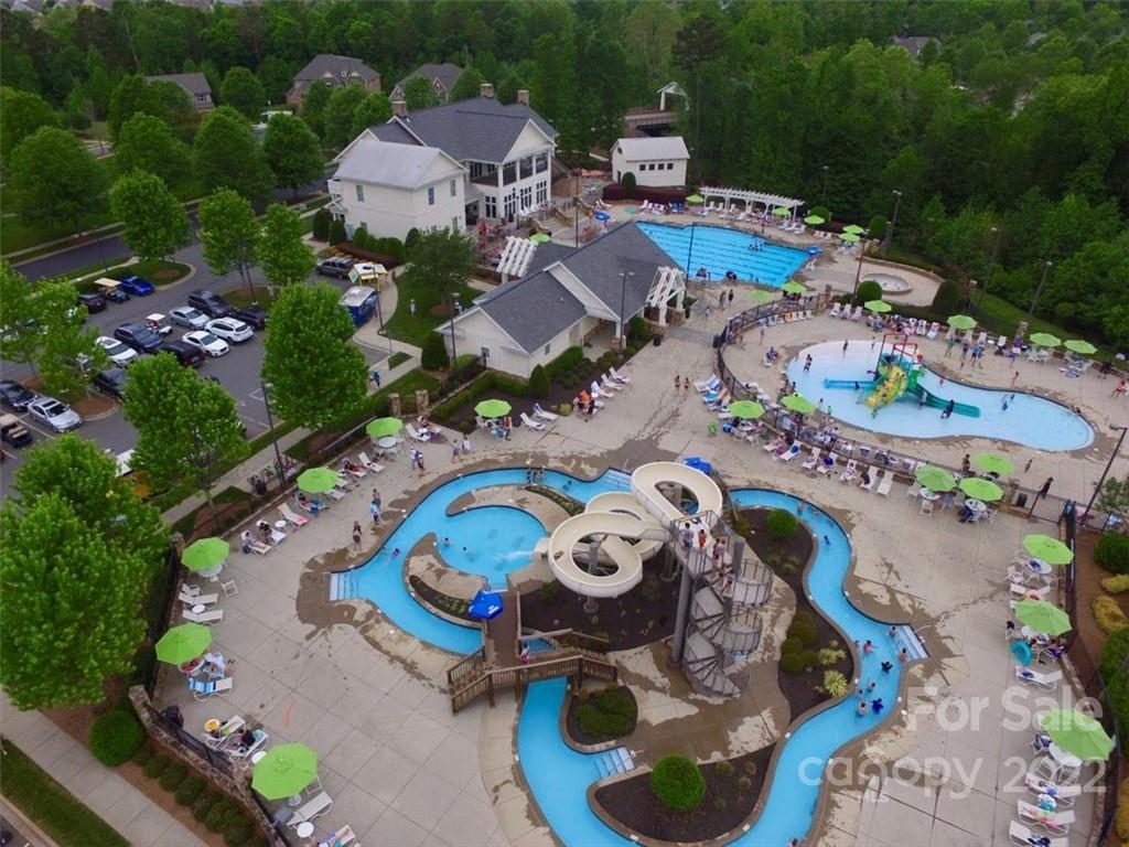 7001 Fallondale Road Waxhaw, NC 28173 - Photo 31 of 32 an aerial view of a swimming pool with lawn chairs and plants