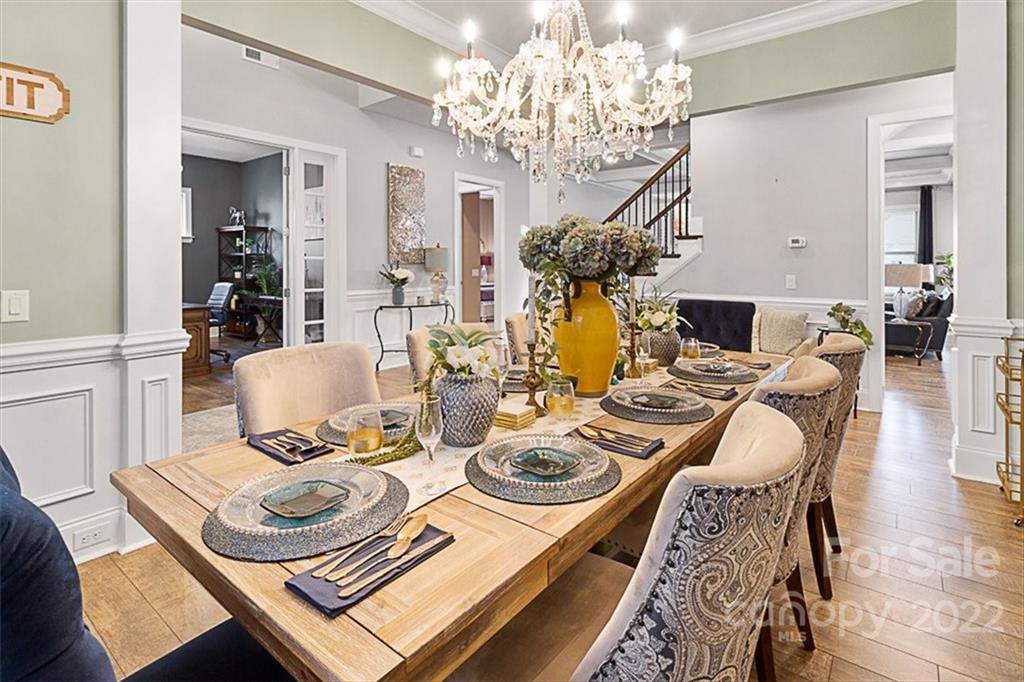 7001 Fallondale Road Waxhaw, NC 28173 - Photo 5 of 32 a view of a dining room with furniture and a chandelier