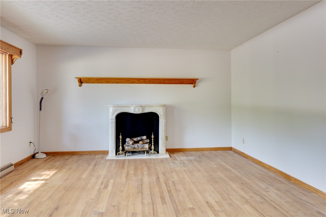 3433 Greenwich Road Barberton, OH 44203 - Photo 6 of 41 This is a large living room at 21' x 14', giving you a lot of space to personalize as you wish.