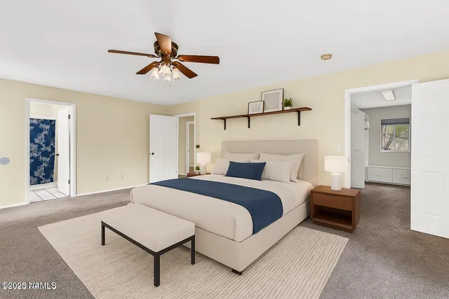 a bedroom with a bed and ceiling fan
