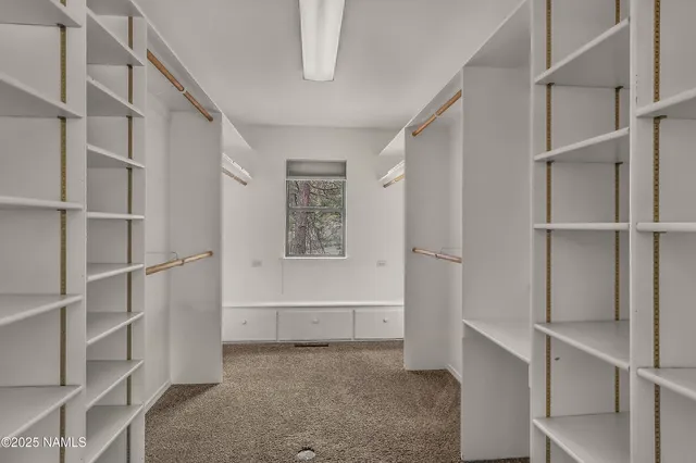 a view of an empty walk in closet