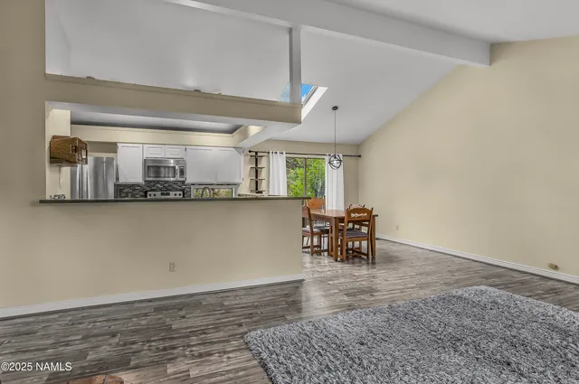 a view of kitchen with furniture and a window