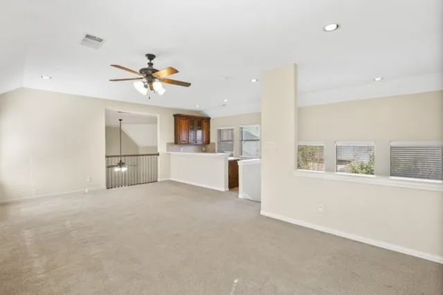 a view of a kitchen with furniture and a kitchen area