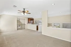 a view of livingroom with furniture and ceiling fan