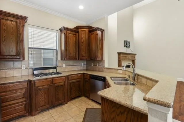 a kitchen with a sink and cabinets