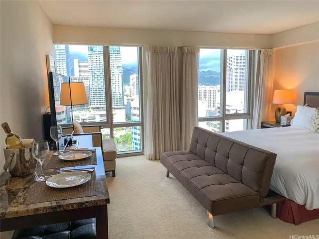 a living room with furniture and a large window