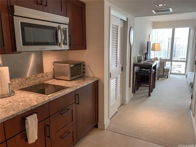 a kitchen with a sink and a microwave