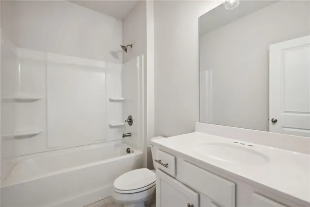 a bathroom with a sink a toilet and a bathtub