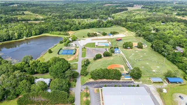 an aerial view of a house with a garden statue
