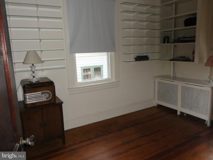104 Sycamore Road Linthicum, MD 21090 - Photo 4 of 13 a view of a storage & utility room with wooden floor