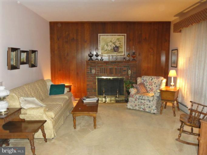 104 Sycamore Road Linthicum, MD 21090 - Photo 7 of 13 a living room with furniture and a fireplace