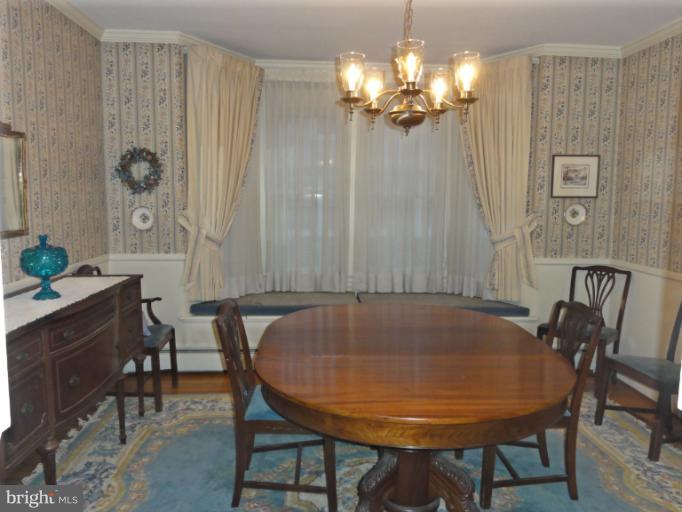 104 Sycamore Road Linthicum, MD 21090 - Photo 9 of 13 a view of a dining room with furniture and chandelier