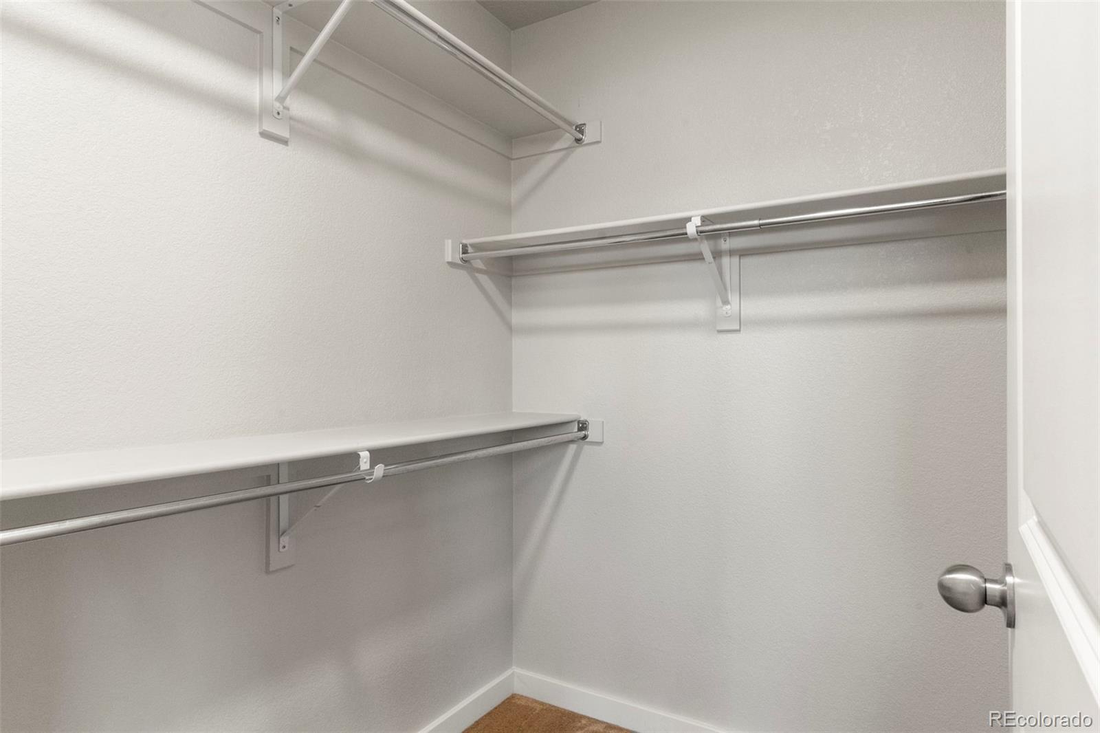 2222 Valentia Street Denver, CO 80238 - Photo 14 of 26 a view of a room with racks on the wall