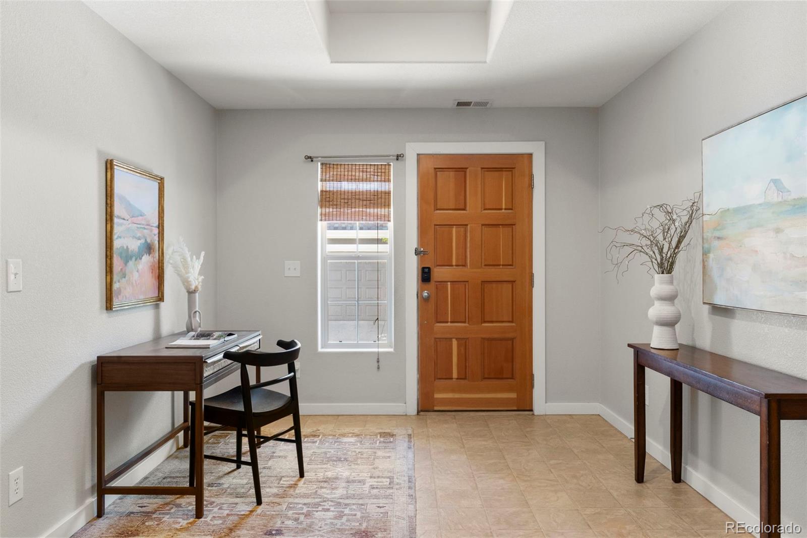 2222 Valentia Street Denver, CO 80238 - Photo 2 of 26 a view of a workspace with furniture and a window