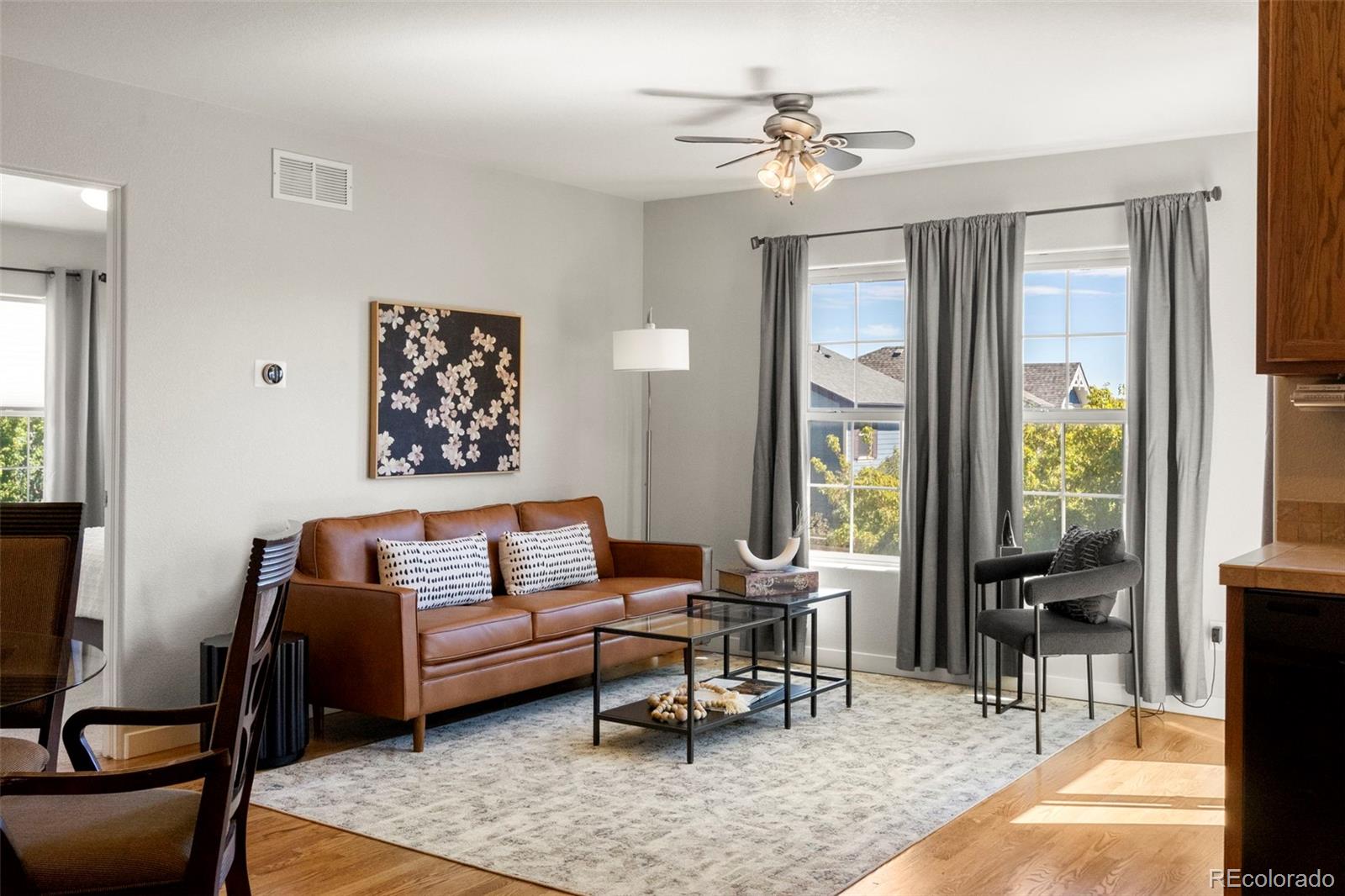 2222 Valentia Street Denver, CO 80238 - Photo 2 of 25 a living room with furniture and a large window