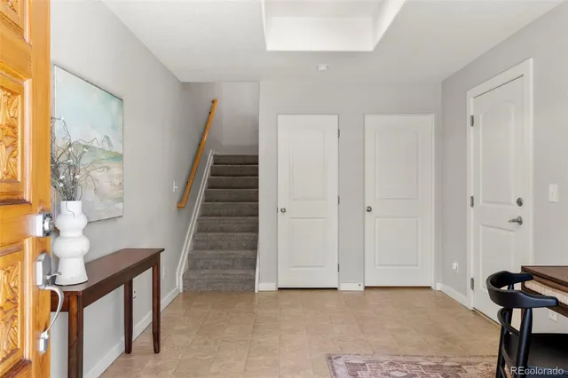 a view of entryway and hall with wooden floor