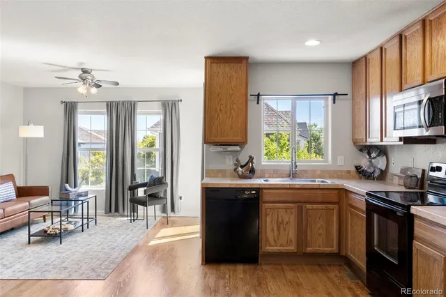 a kitchen with a sink stove and cabinets