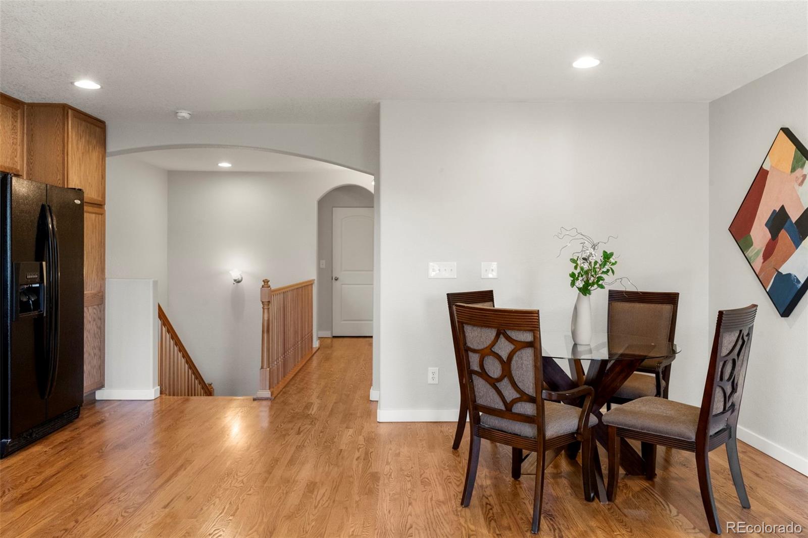 2222 Valentia Street Denver, CO 80238 - Photo 9 of 26 a view of a dining room with furniture and wooden floor