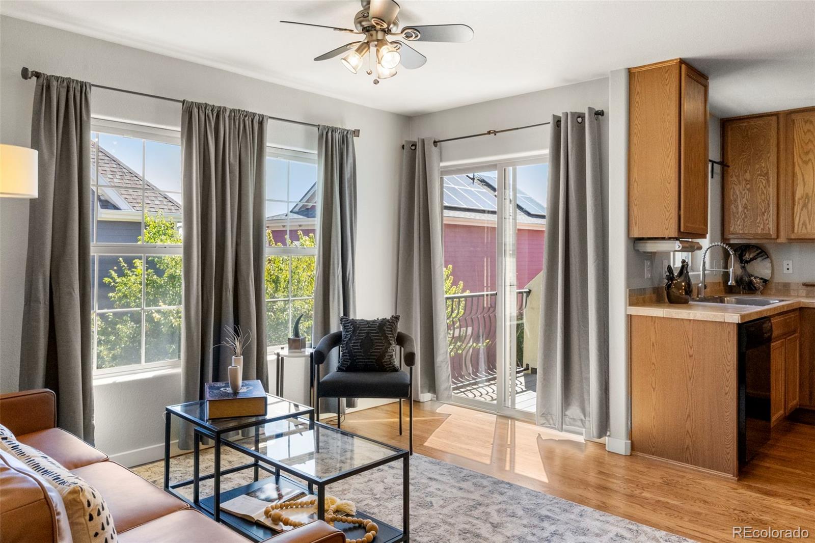 2222 Valentia Street Denver, CO 80238 - Photo 10 of 26 a living room with furniture and large windows