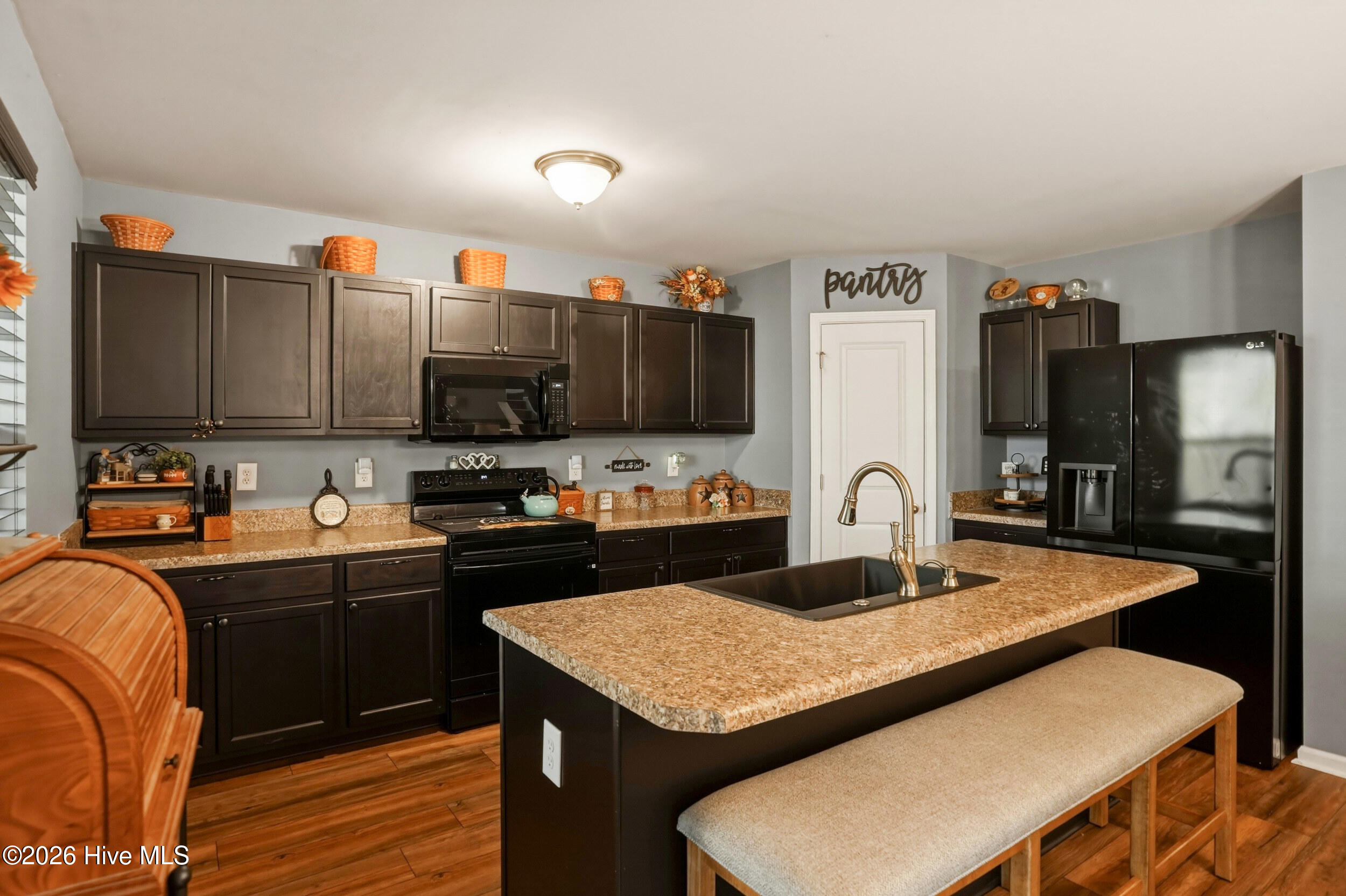 793 Landmark Cove Calabash, NC 28467 - Photo 13 of 53 Well-appointed kitchen with plentiful cabinetry and a pantry, providing generous storage for all essentials.