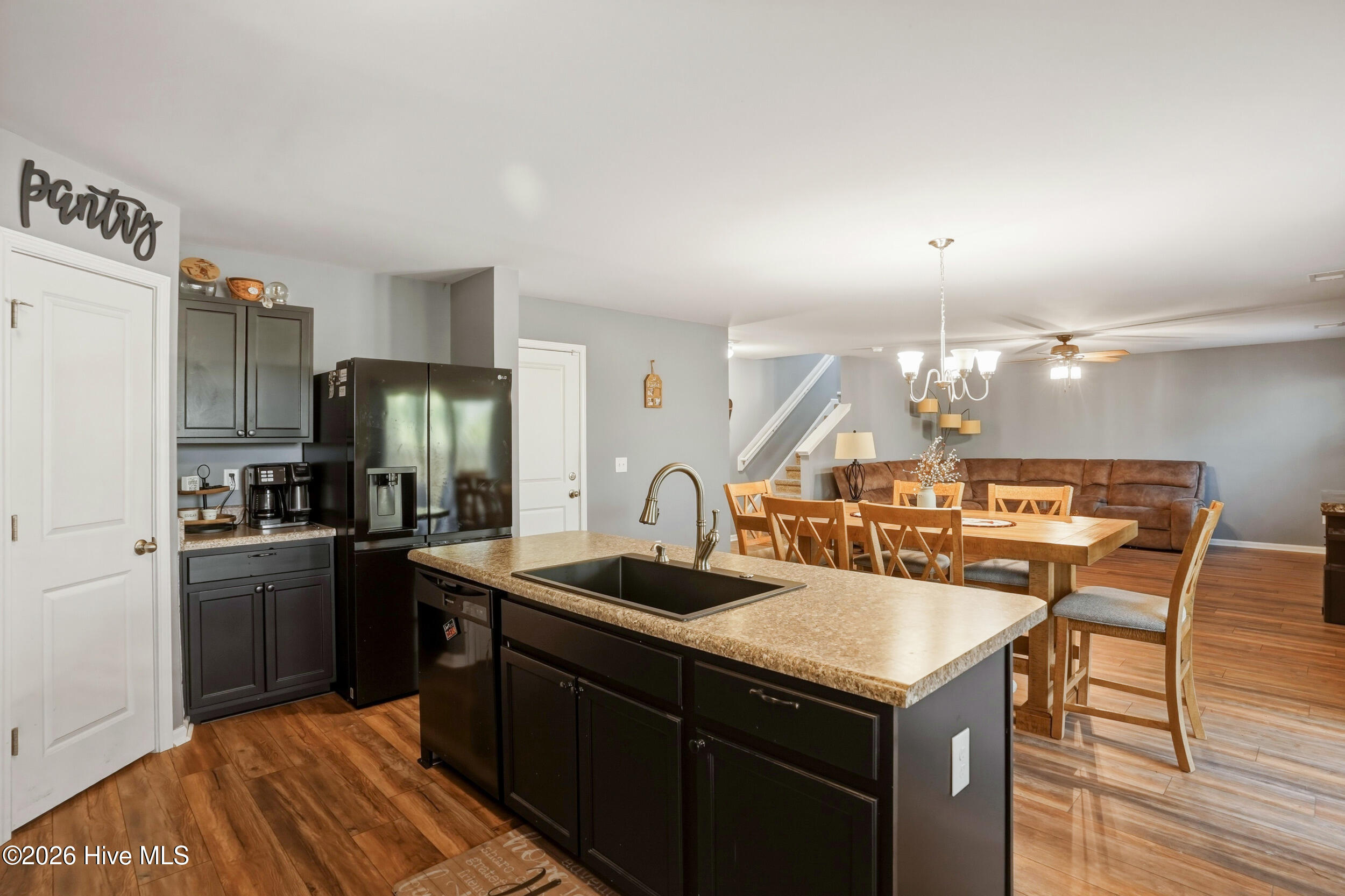 793 Landmark Cove Calabash, NC 28467 - Photo 17 of 53 Bright, airy kitchen flowing seamlessly into the dining and living areas, perfect for effortless entertaining and connected living.