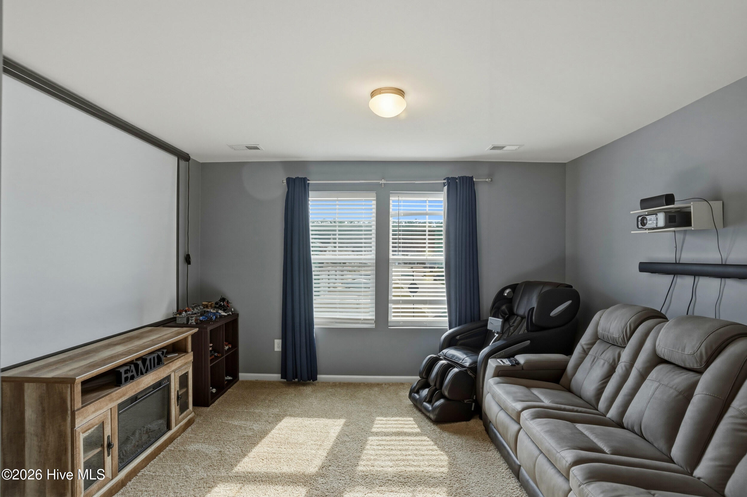 793 Landmark Cove Calabash, NC 28467 - Photo 29 of 53 Spacious upstairs room with abundant natural light, designed for versatile use to suit a variety of functional needs.