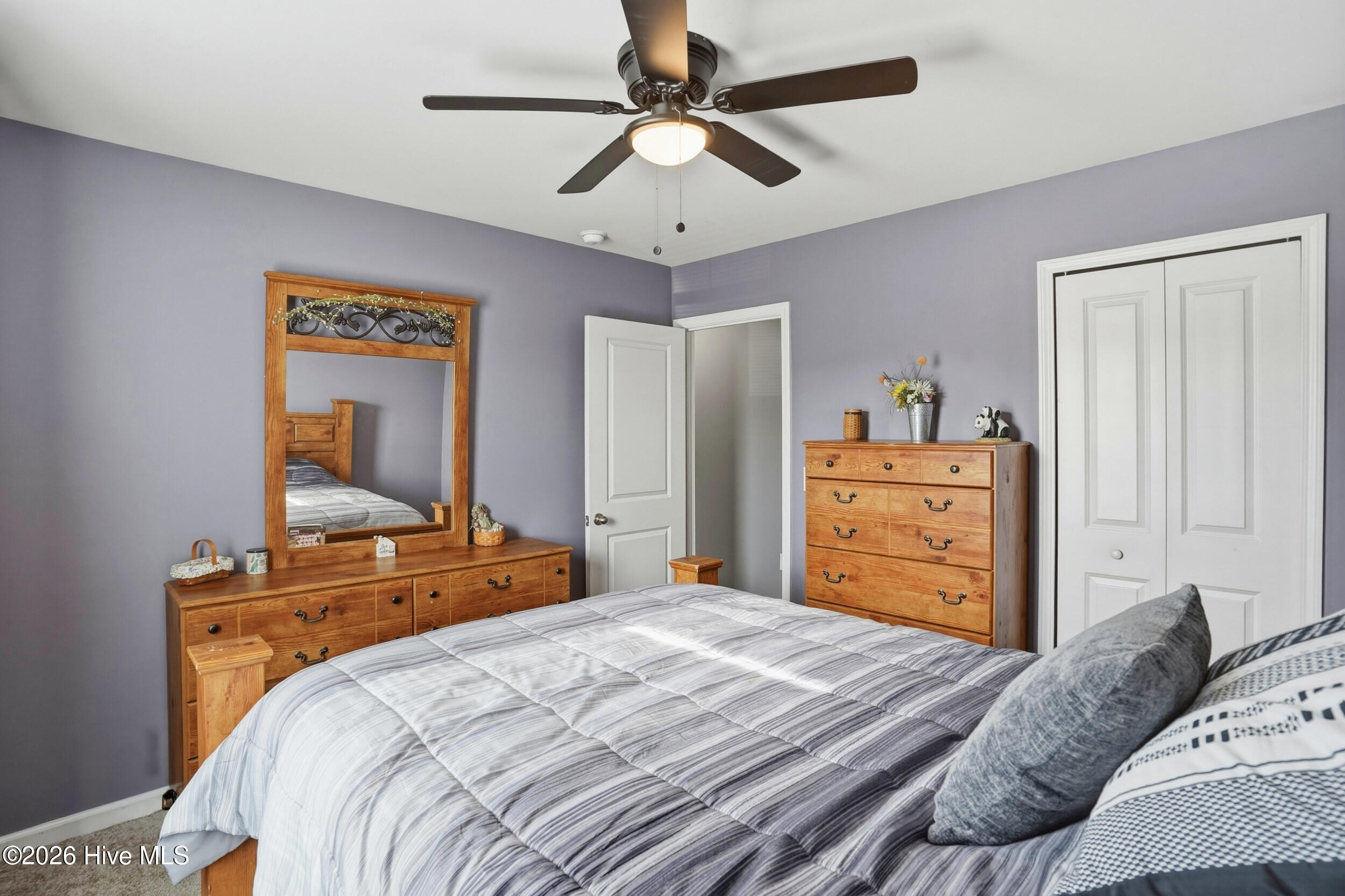 793 Landmark Cove Calabash, NC 28467 - Photo 32 of 53 Well-proportioned upstairs bedroom with a ceiling fan and bright, airy atmosphere, providing a flexible layout to suit any needs.