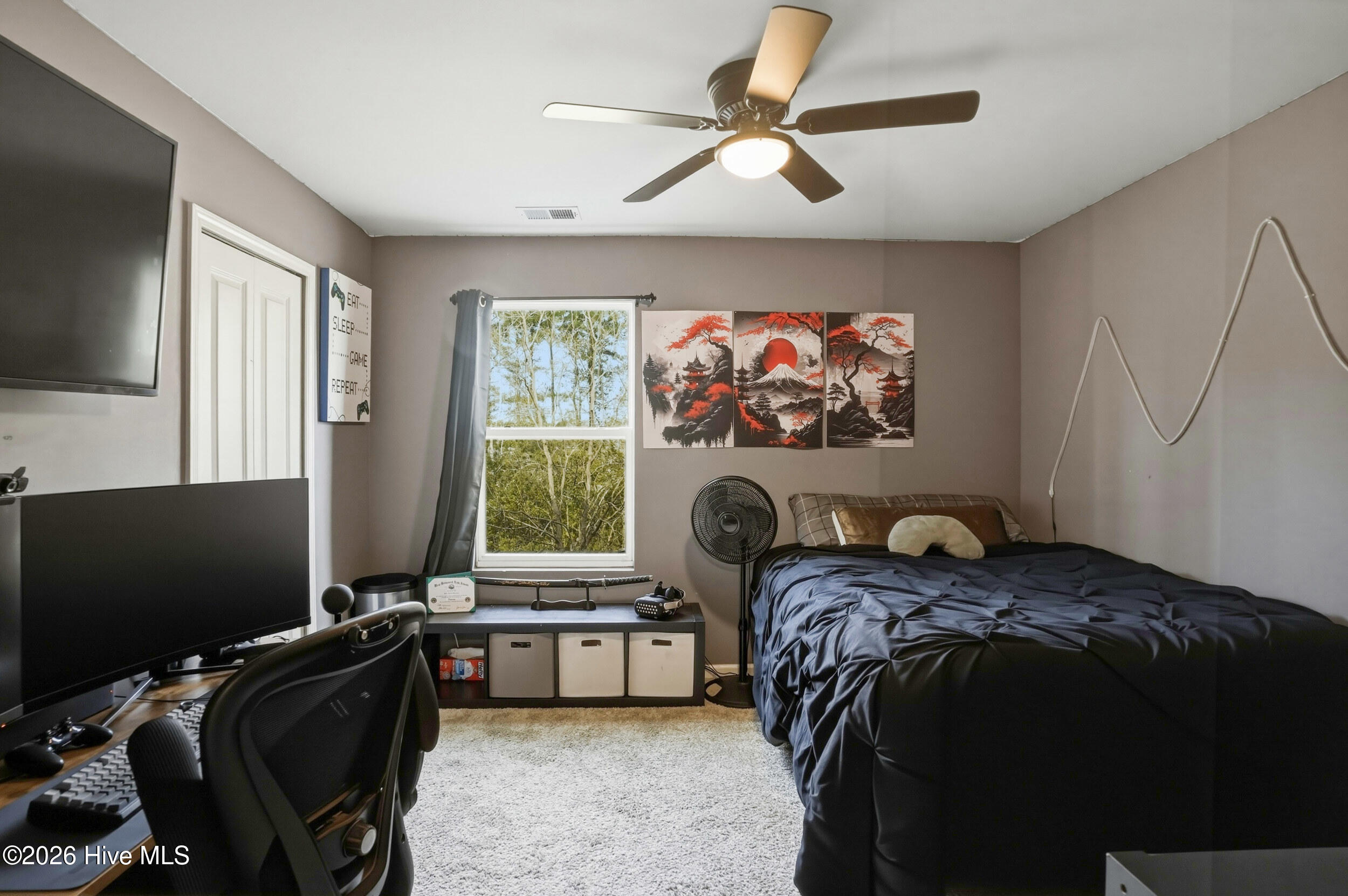 793 Landmark Cove Calabash, NC 28467 - Photo 34 of 53 Bright upstairs bedroom featuring a ceiling fan and ample space, offering a flexible layout for a variety of uses.