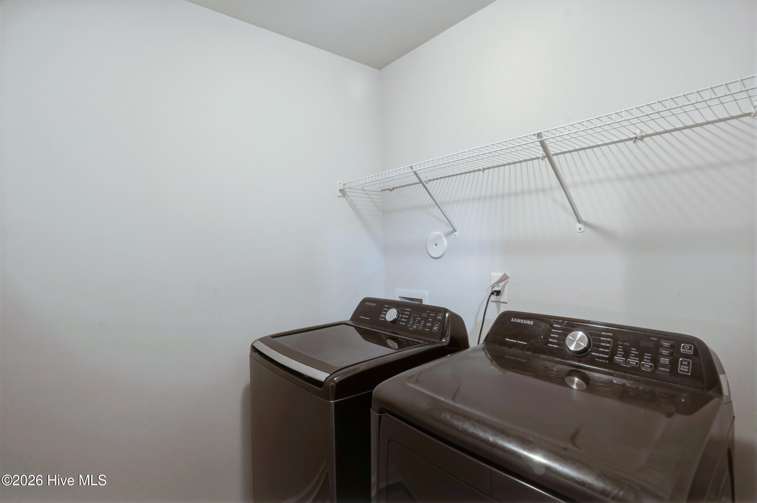 793 Landmark Cove Calabash, NC 28467 - Photo 36 of 53 Well-appointed laundry room offering ample space and functionality, designed for efficient daily use.