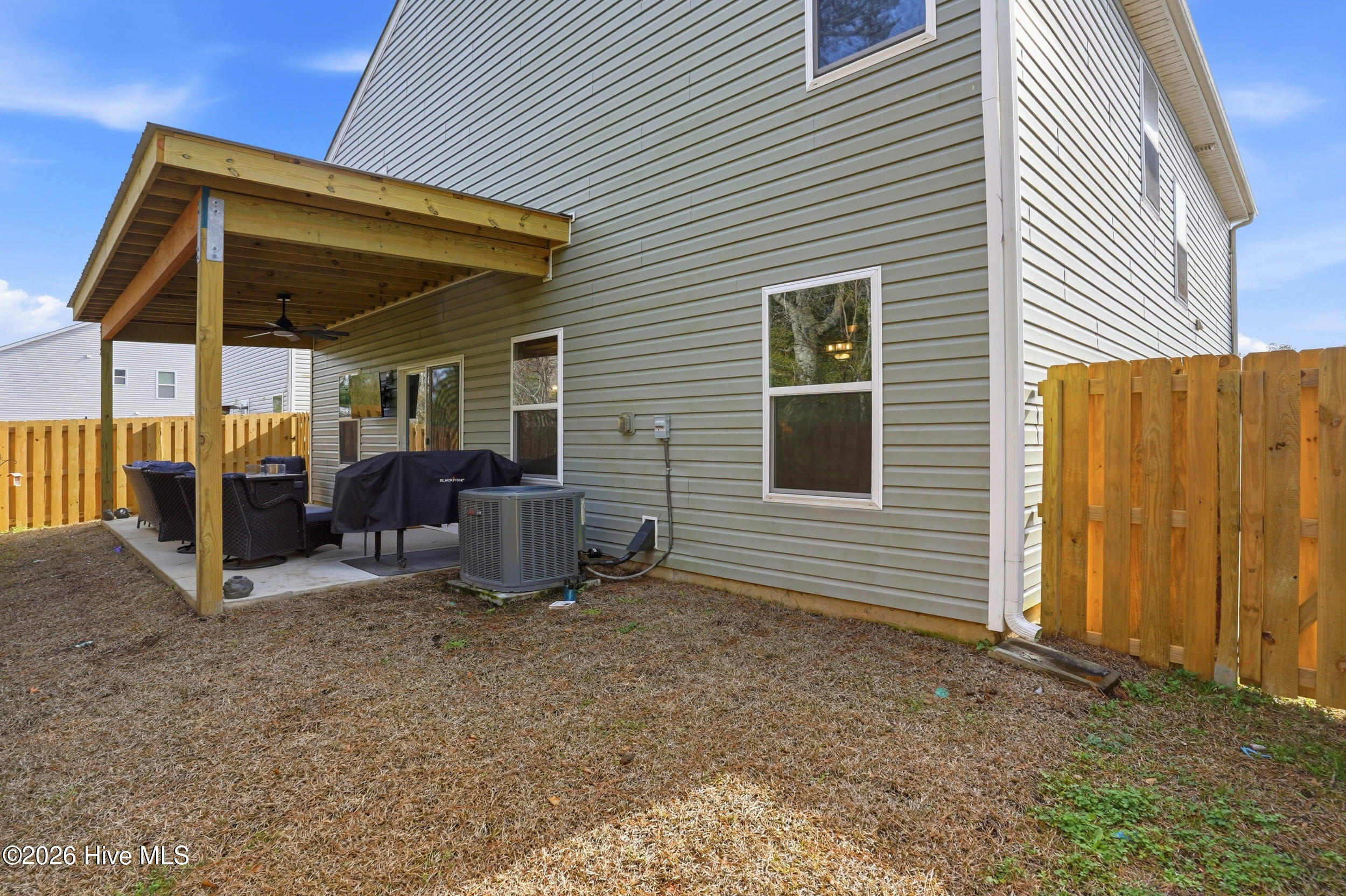 793 Landmark Cove Calabash, NC 28467 - Photo 40 of 53 Fully fenced backyard offering a low-maintenance outdoor space, providing privacy and room to enjoy the outdoors with minimal upkeep.