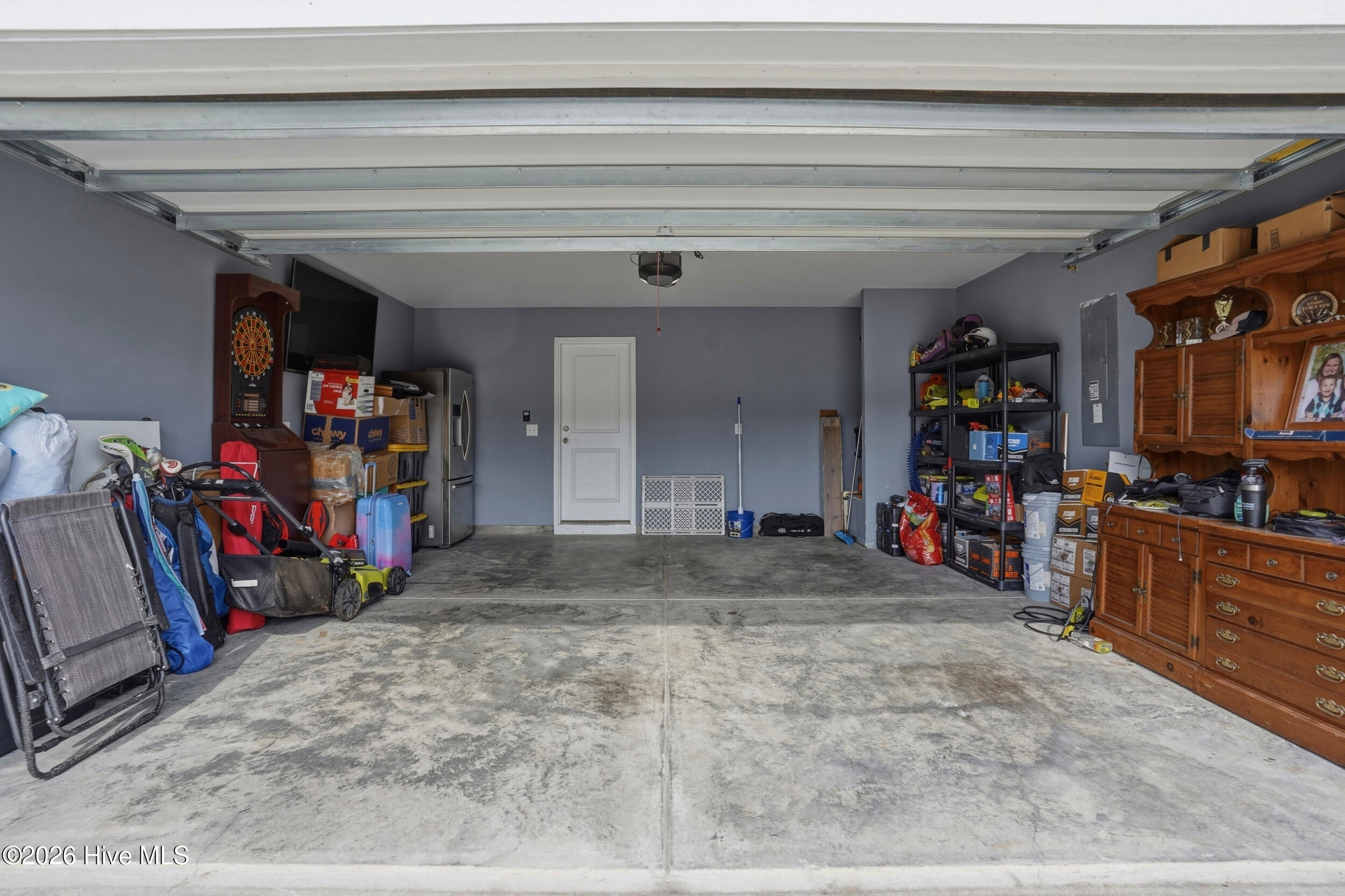 793 Landmark Cove Calabash, NC 28467 - Photo 42 of 53 Spacious two-car garage providing ample parking and storage, designed for convenience and ease of access.
