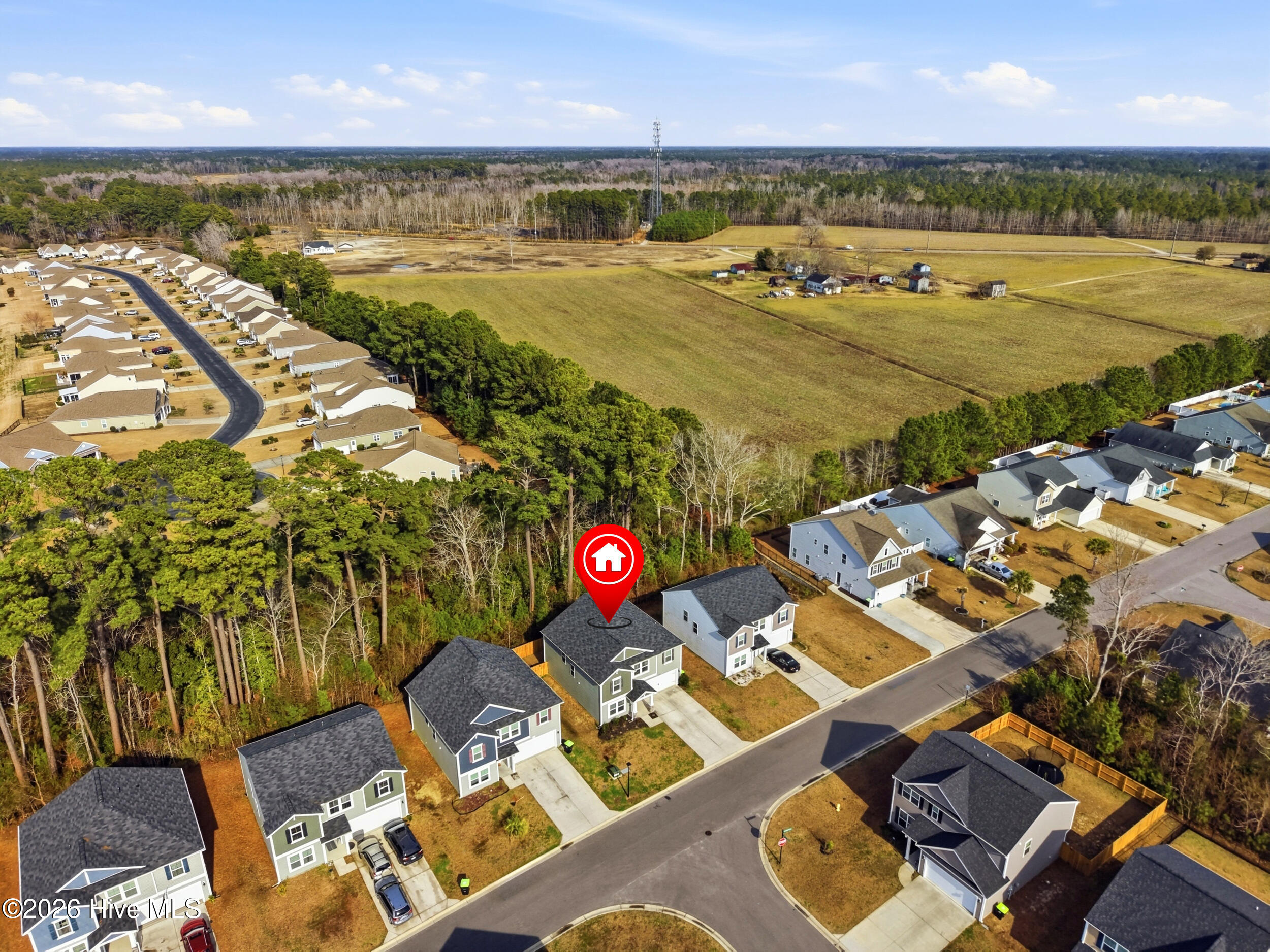 793 Landmark Cove Calabash, NC 28467 - Photo 45 of 53 Drone view showcasing the neighborhood with a highlighted pin marking the home’s location, providing context on its position within the community.