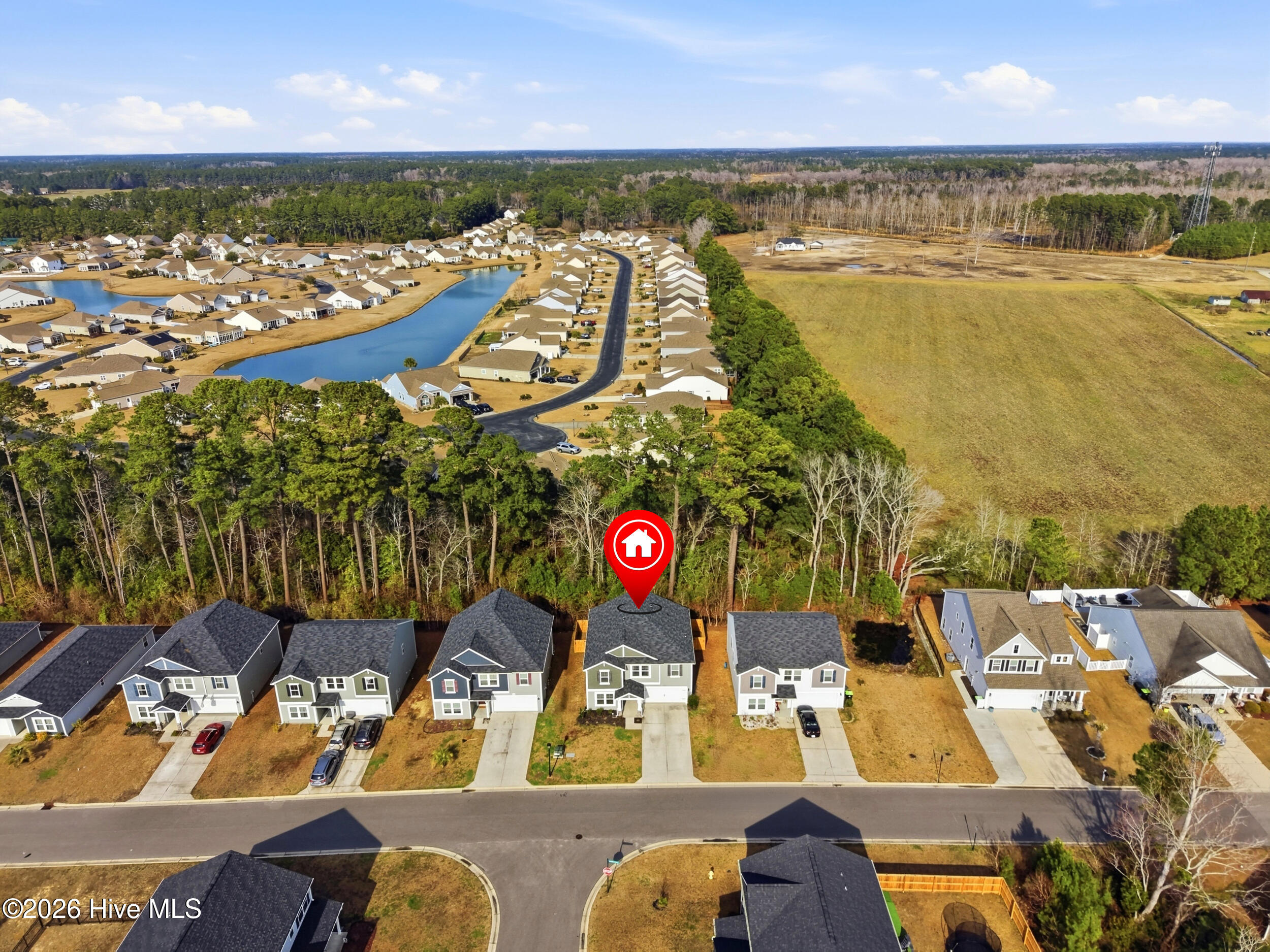 793 Landmark Cove Calabash, NC 28467 - Photo 46 of 53 Aerial perspective of surrounding streets and homes, emphasizing the community layout and the home’s location with a pin.
