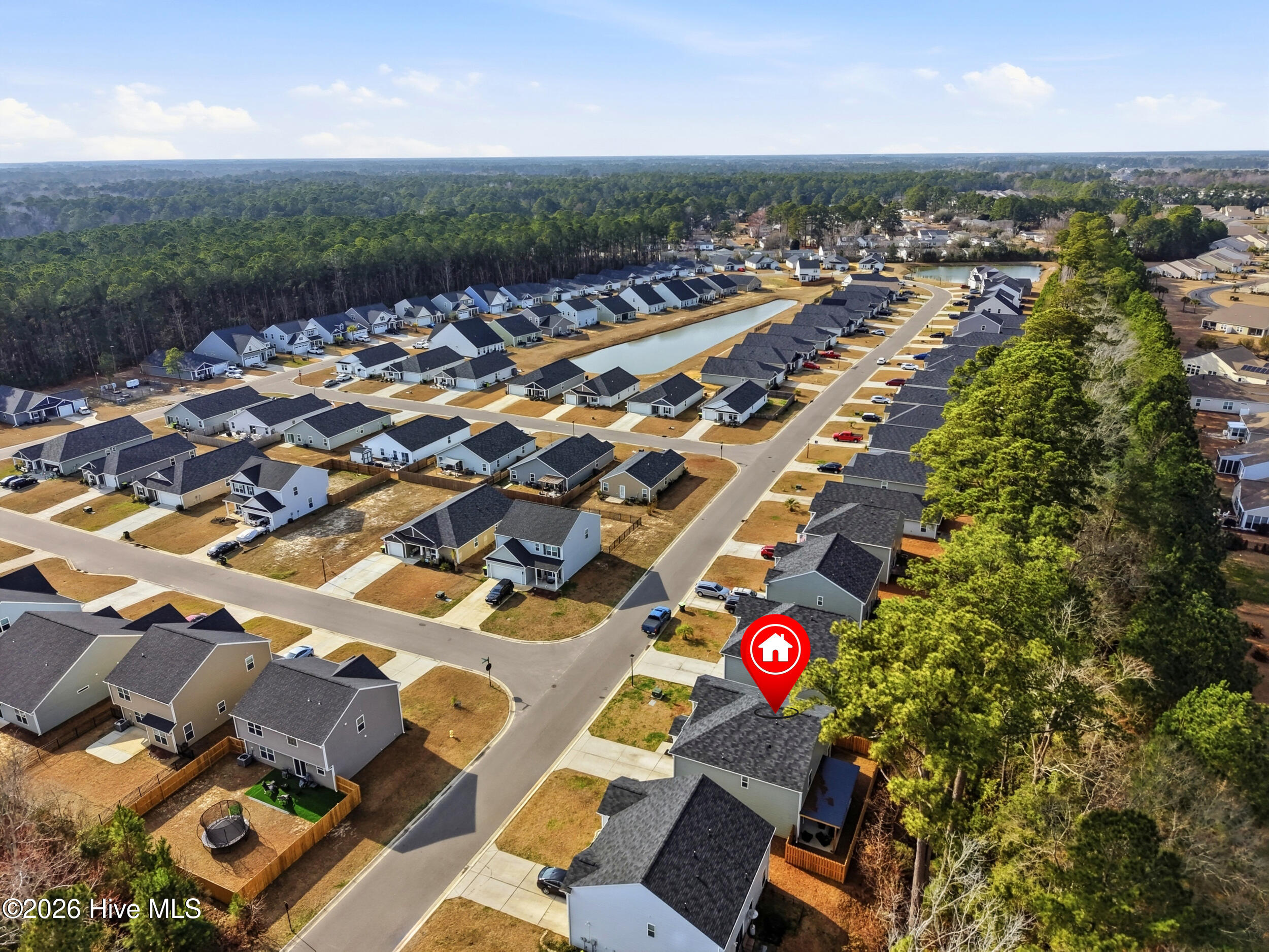 793 Landmark Cove Calabash, NC 28467 - Photo 48 of 53 Aerial view showing the neighborhood streetscape and nearby homes, with the property location clearly marked.