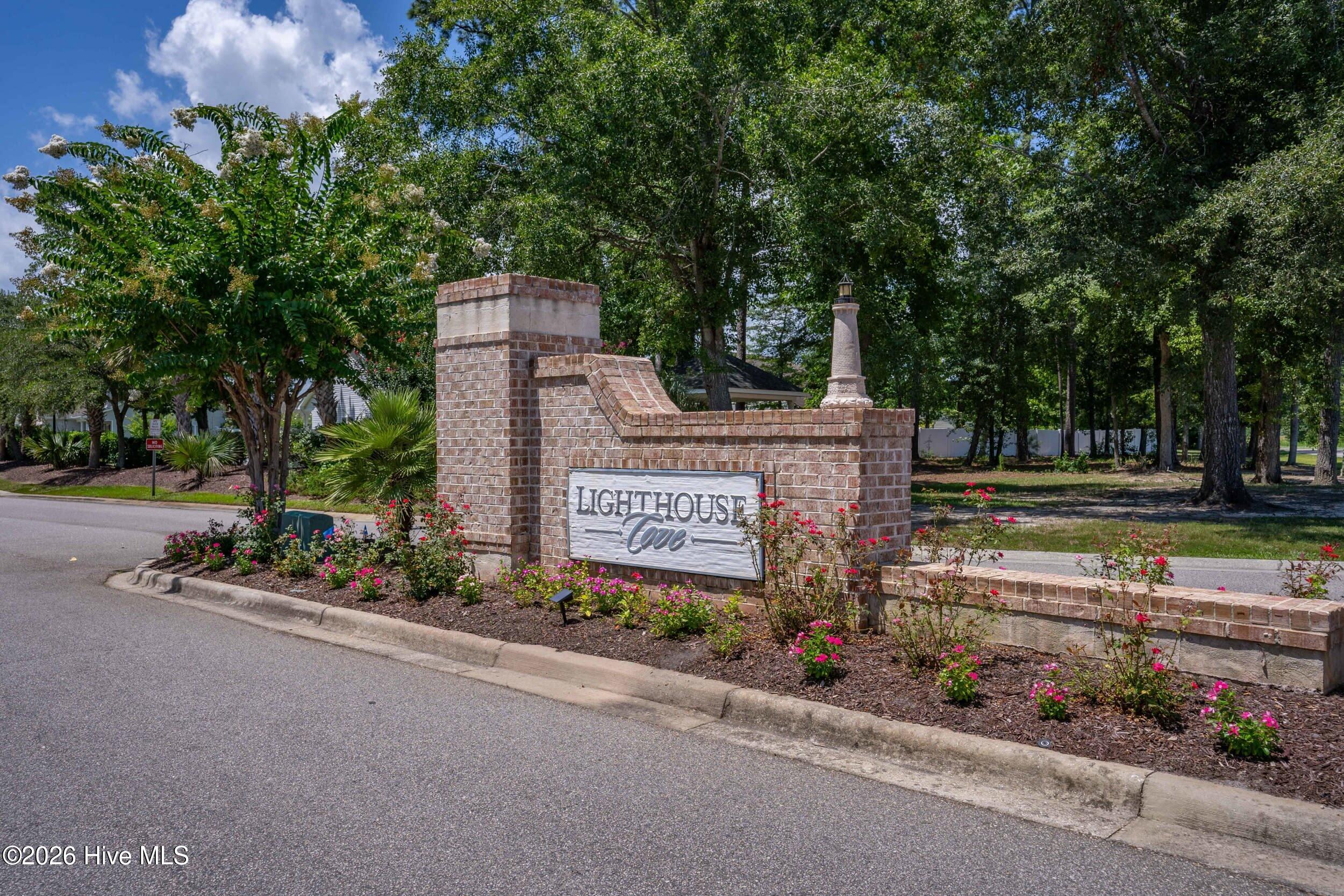 793 Landmark Cove Calabash, NC 28467 - Photo 51 of 53 ew of the neighborhood entrance, showcasing convenient access, well-maintained surroundings, and the inviting curb appeal of the community.