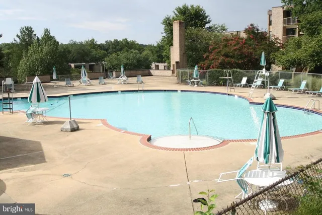 a view of a swimming pool with a patio