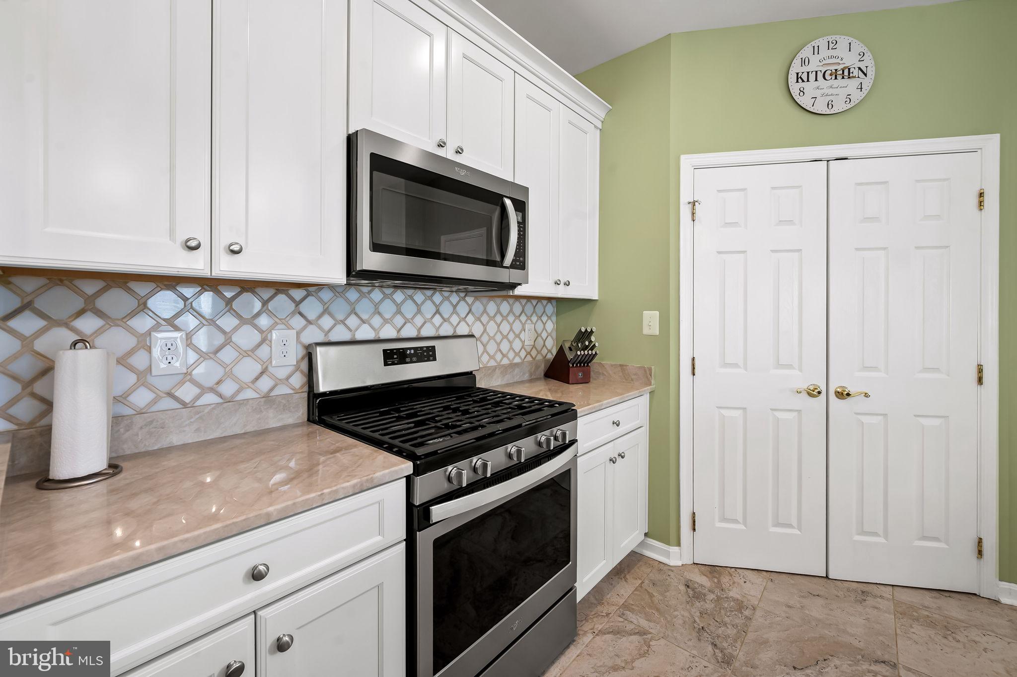 2015 Colgate Circle Forest Hill, MD 21050 - Photo 14 of 50 a kitchen with white cabinets and stainless steel appliances