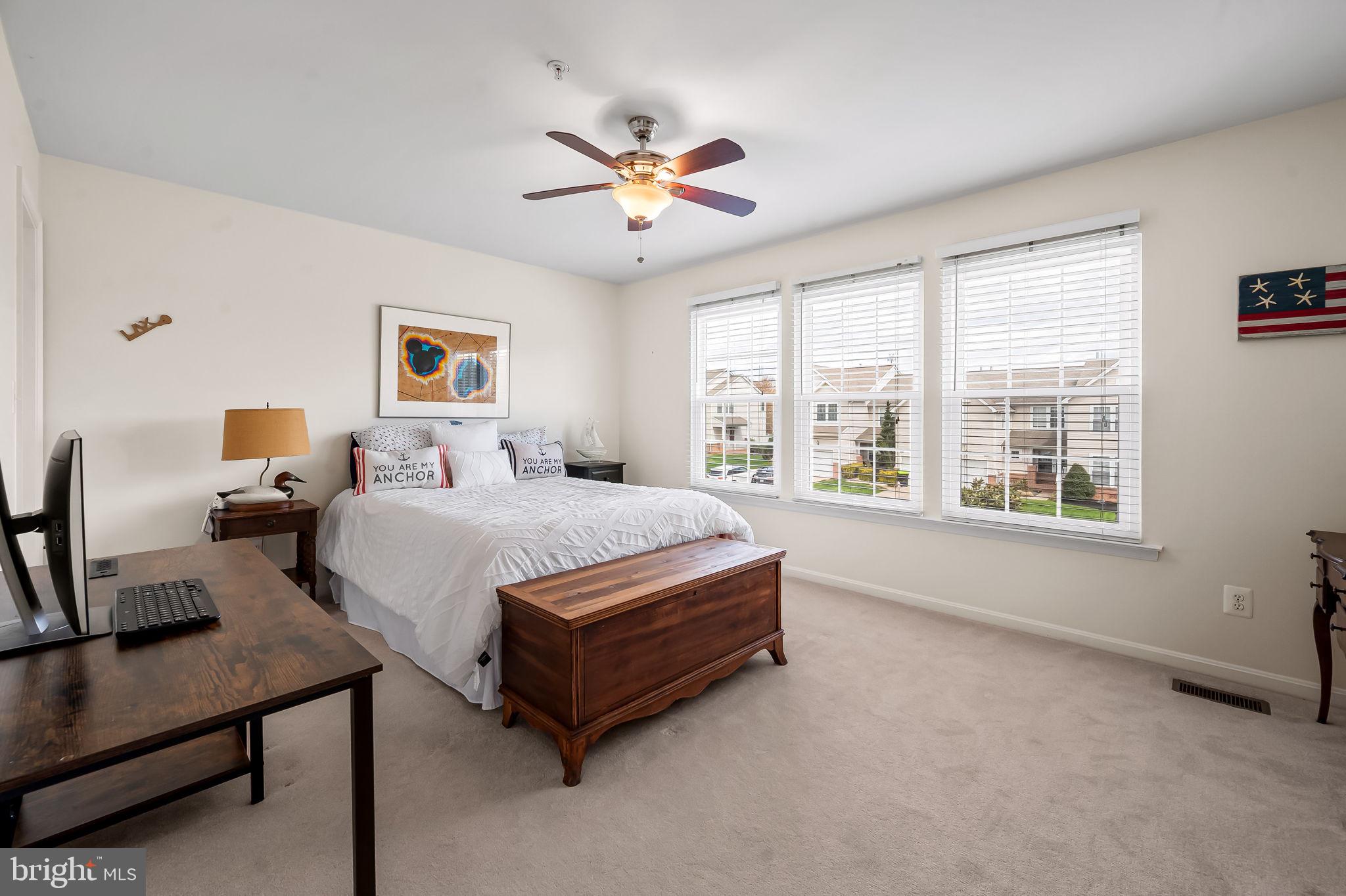 2015 Colgate Circle Forest Hill, MD 21050 - Photo 21 of 50 a spacious bedroom with a bed and a chandelier
