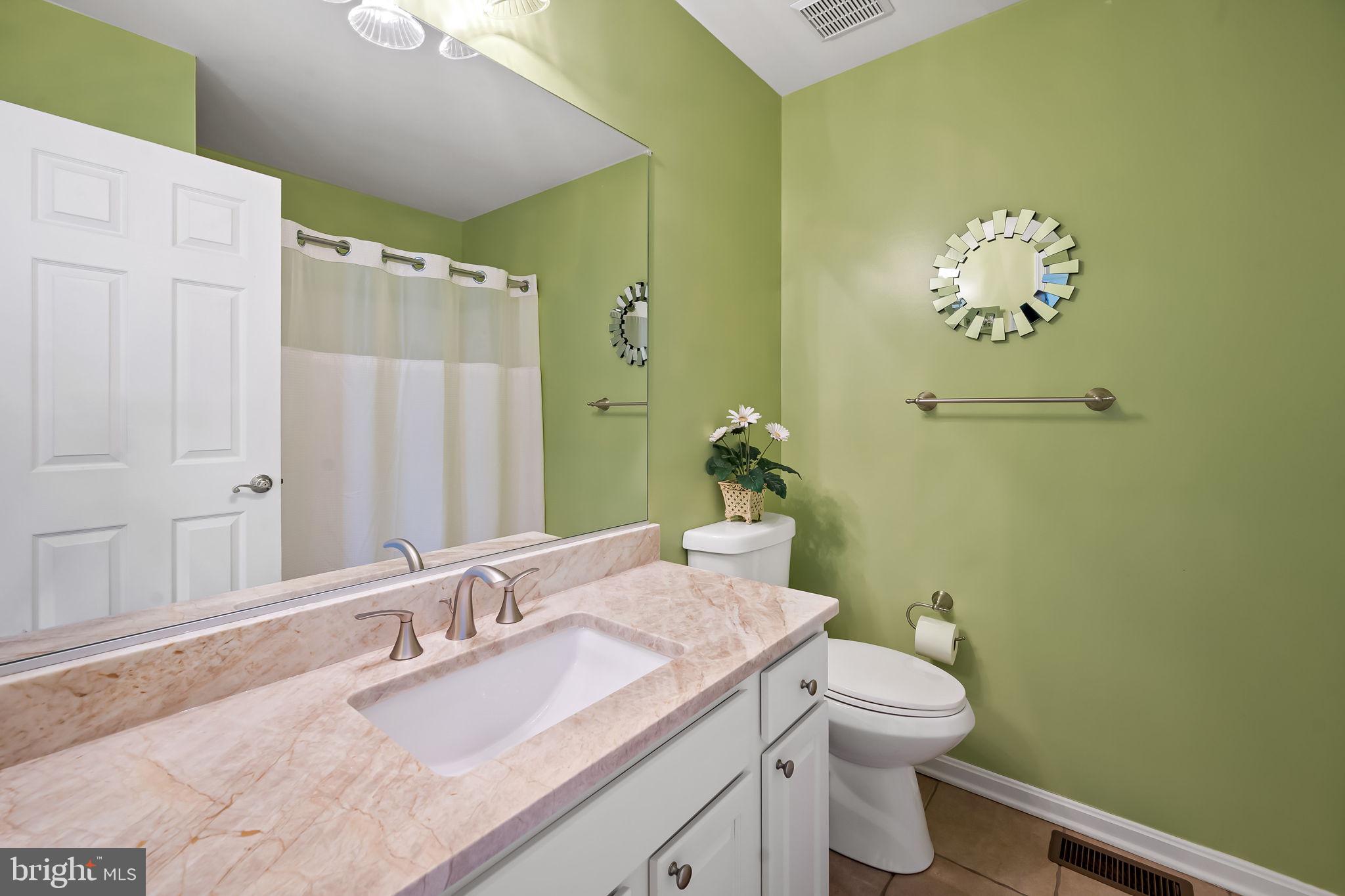 2015 Colgate Circle Forest Hill, MD 21050 - Photo 29 of 50 a bathroom with a granite countertop sink a toilet and mirror