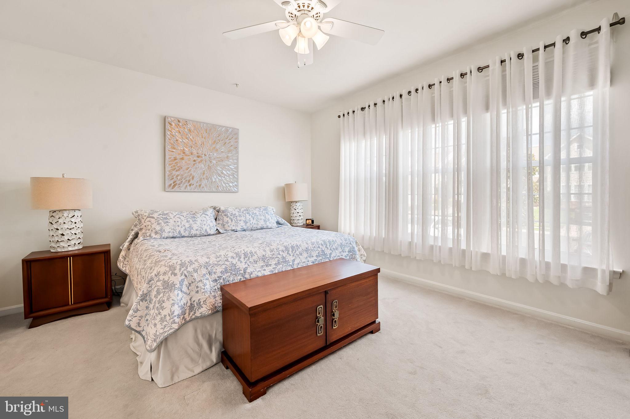 2015 Colgate Circle Forest Hill, MD 21050 - Photo 31 of 50 a spacious bedroom with a bed and a chandelier