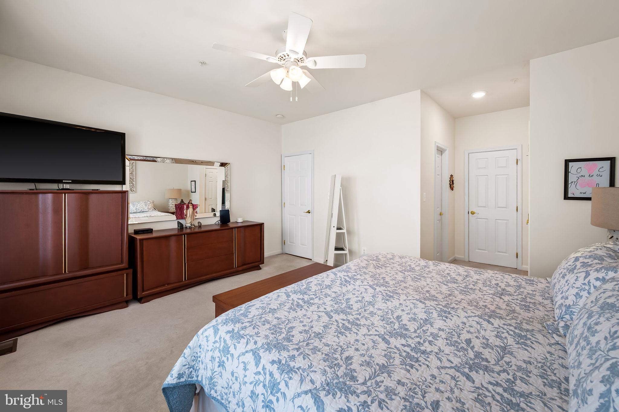 2015 Colgate Circle Forest Hill, MD 21050 - Photo 33 of 50 a bedroom with a bed a dresser and potted plant