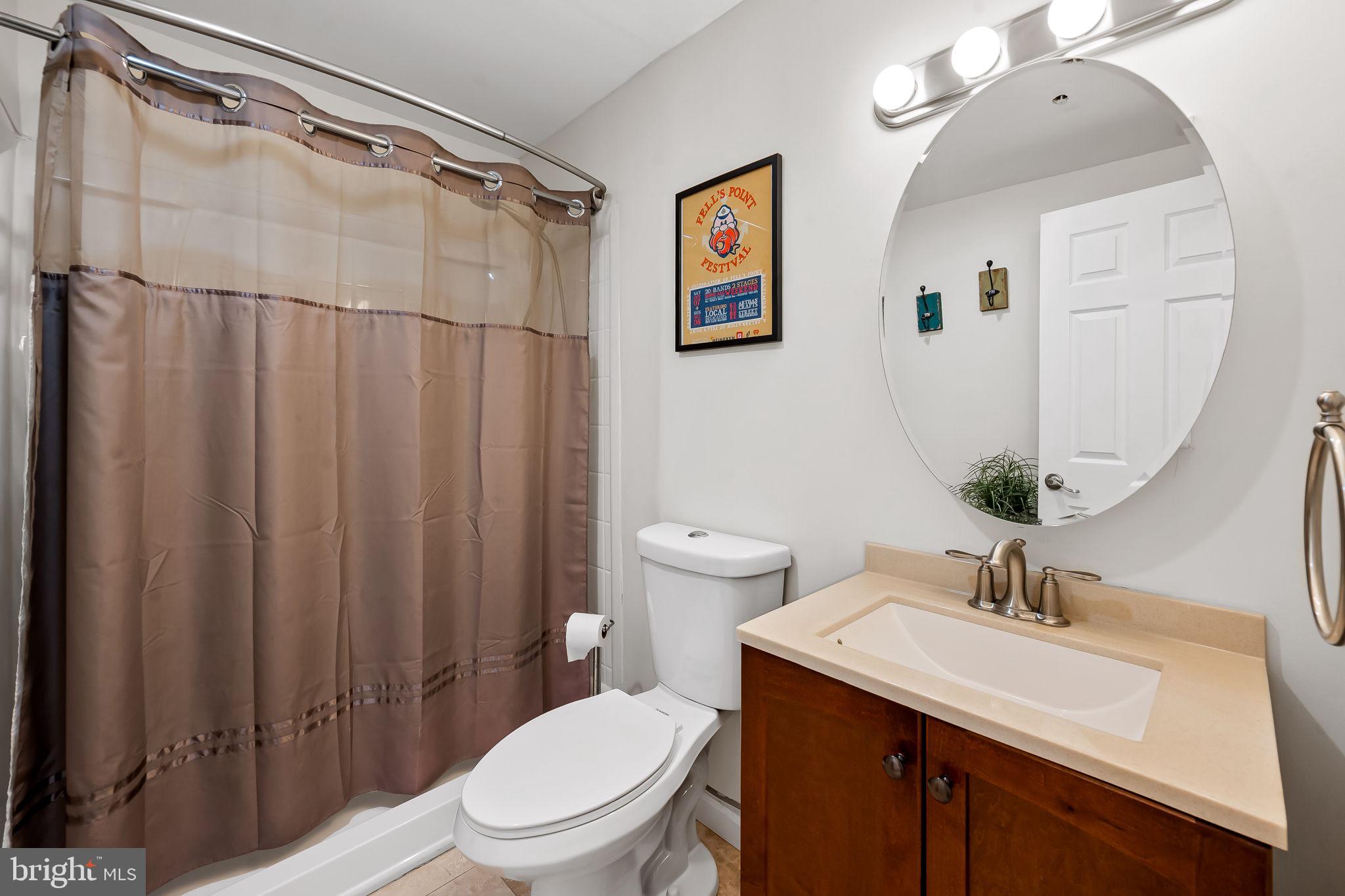 2015 Colgate Circle Forest Hill, MD 21050 - Photo 40 of 50 a bathroom with a sink a toilet and shower curtain