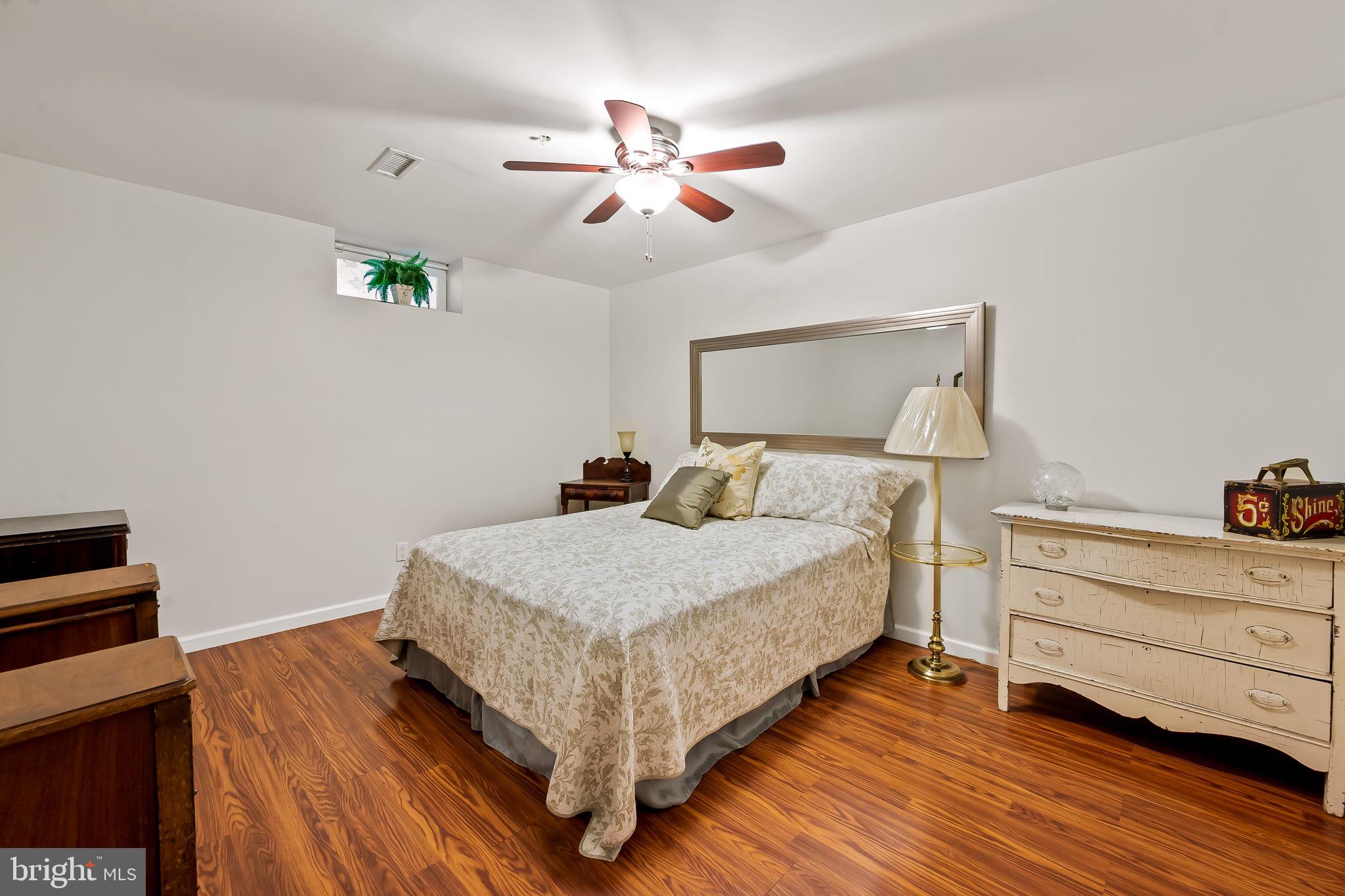 2015 Colgate Circle Forest Hill, MD 21050 - Photo 41 of 50 a bedroom with a bed and a chandelier