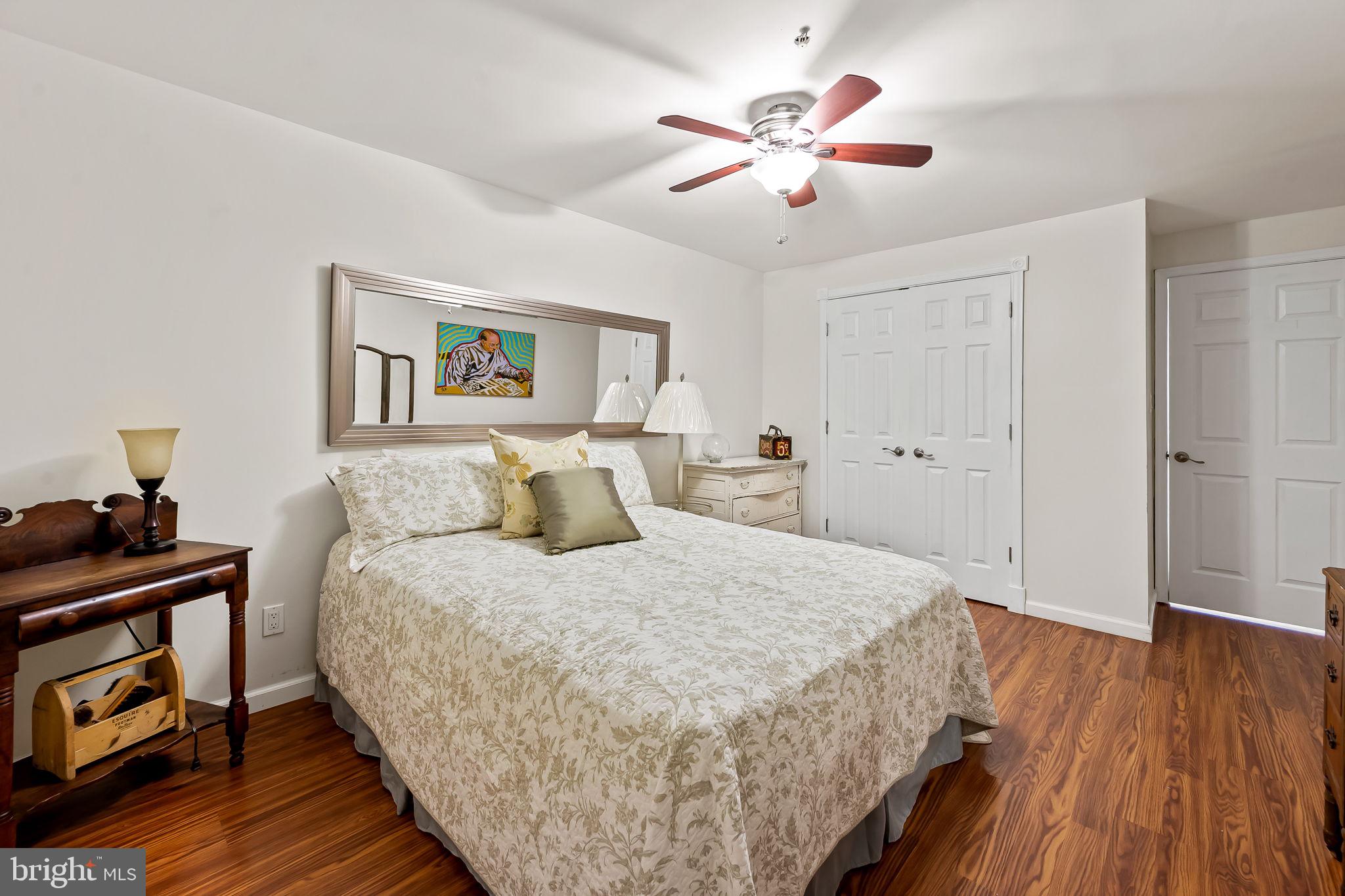 2015 Colgate Circle Forest Hill, MD 21050 - Photo 42 of 50 a spacious bedroom with a bed and a chandelier