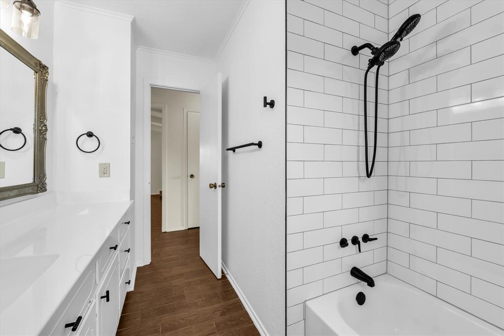 141 Travis Lane Hewitt, TX 76643 - Photo 21 of 31 White subway tile shower surround with matte black fixtures