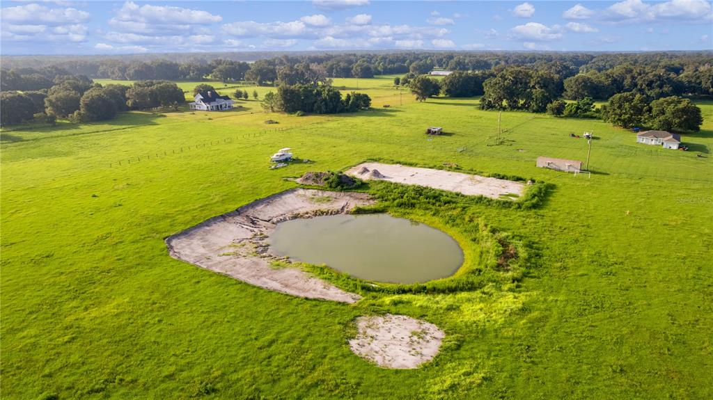 2425 Cr 546a Bushnell Bushnell, FL 33513 - Photo 12 of 15 a swimming pool with trees in the background