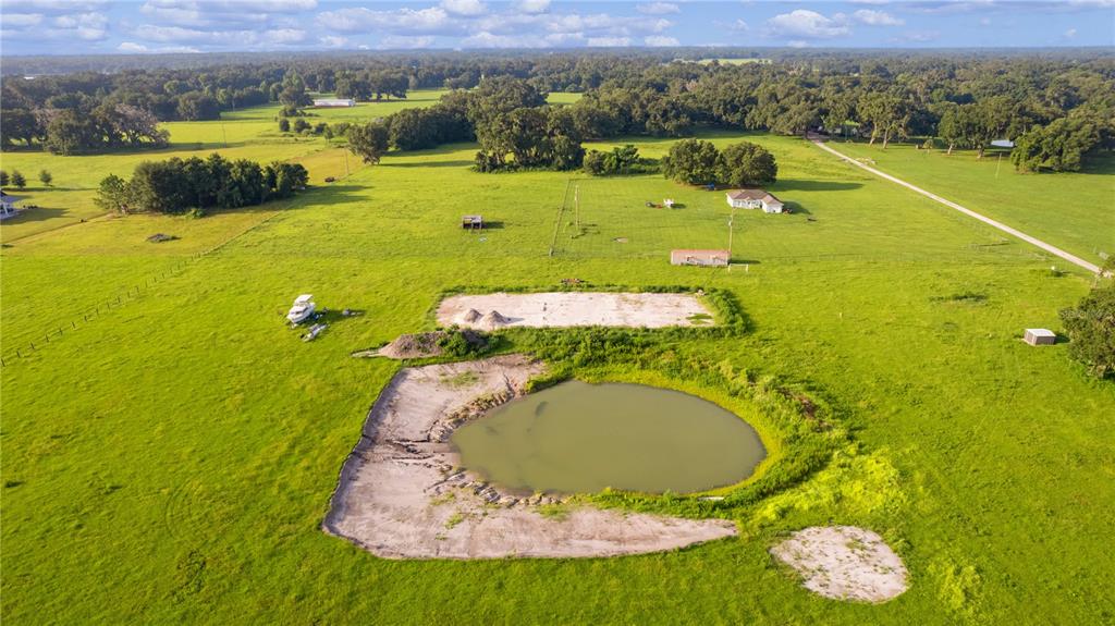 2425 Cr 546a Bushnell Bushnell, FL 33513 - Photo 13 of 15 a view of a swimming pool with a yard