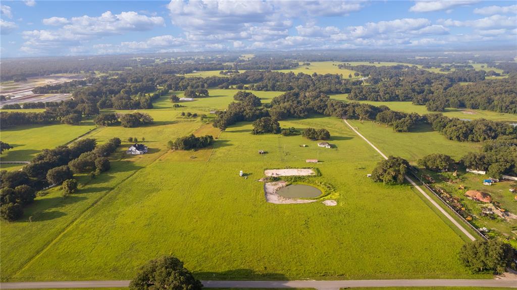 2425 Cr 546a Bushnell Bushnell, FL 33513 - Photo 2 of 15 an aerial view of residential houses with outdoor space