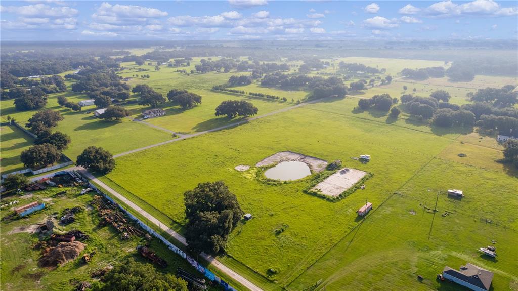 2425 Cr 546a Bushnell Bushnell, FL 33513 - Photo 9 of 15 a view of a swimming pool with a yard